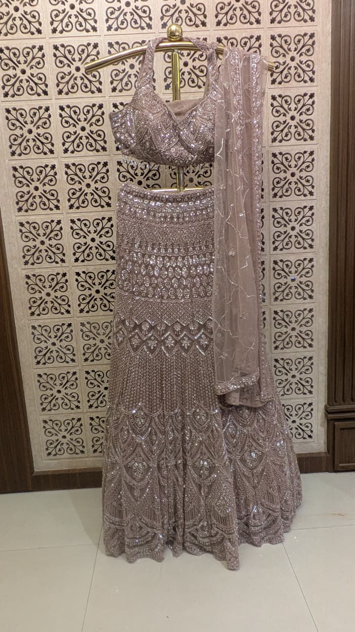 Dusty Mauve Pink Fish-Cut Lehenga Set with Halter Neck Blouse and Sheer Dupatta.