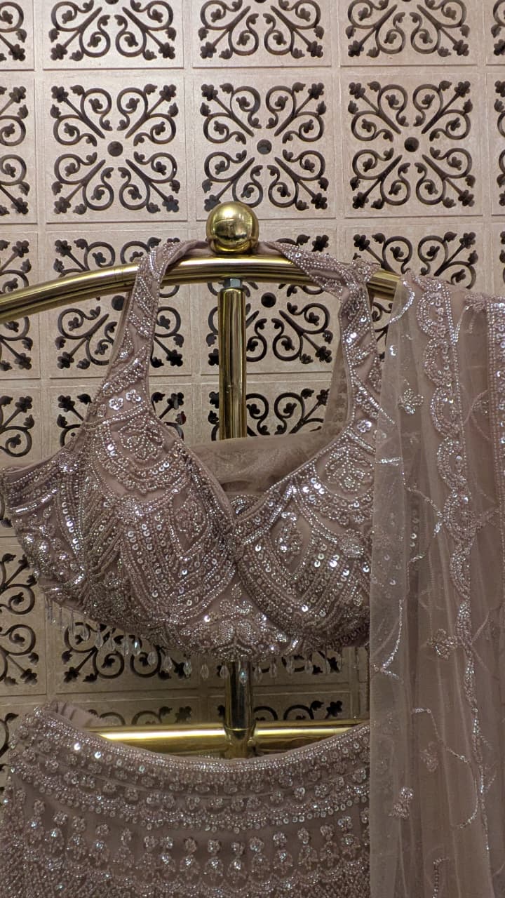 Dusty Mauve Pink Fish-Cut Lehenga Set with Halter Neck Blouse and Sheer Dupatta.