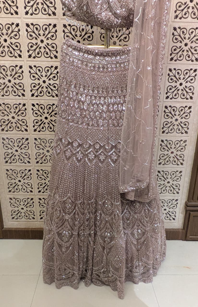 Dusty Mauve Pink Fish-Cut Lehenga Set with Halter Neck Blouse and Sheer Dupatta.