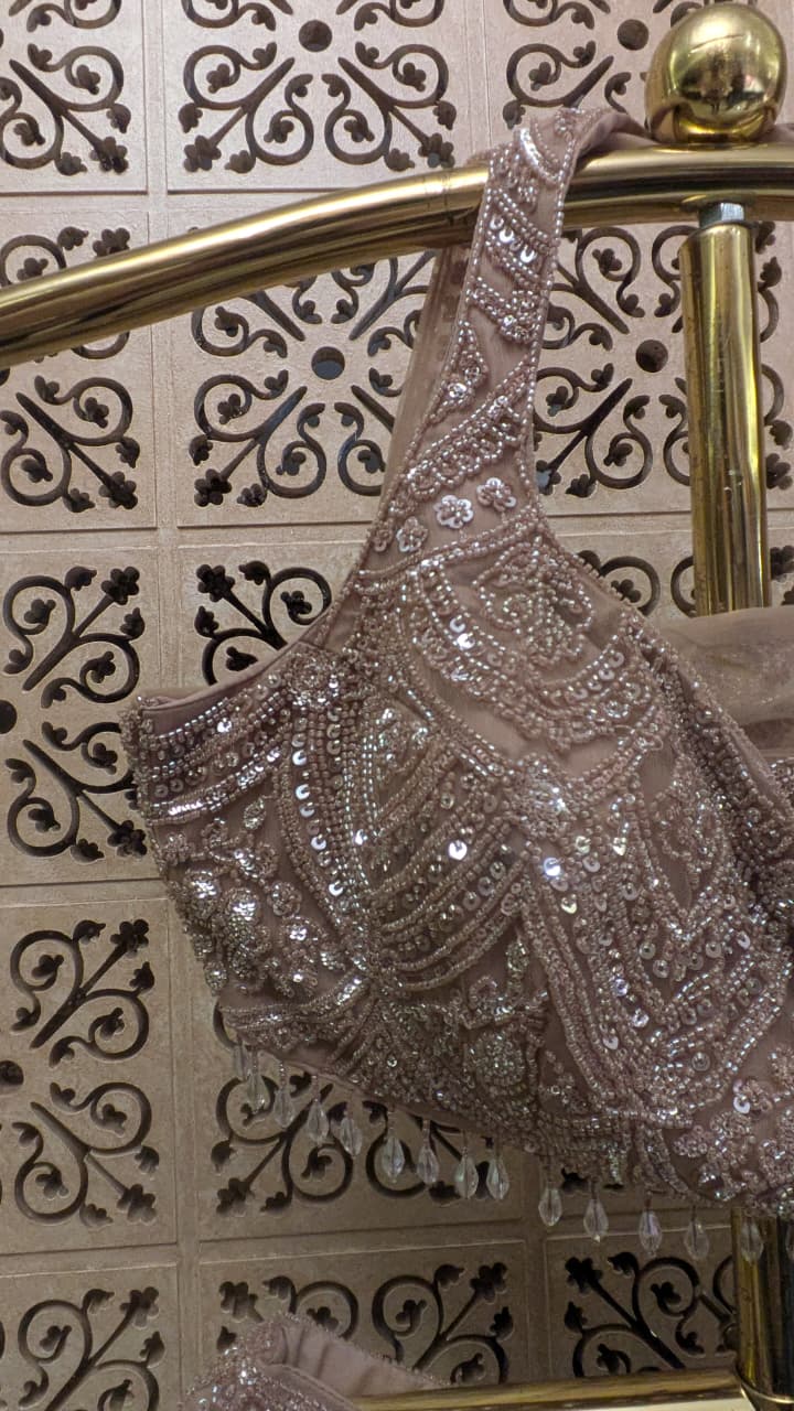Dusty Mauve Pink Fish-Cut Lehenga Set with Halter Neck Blouse and Sheer Dupatta.