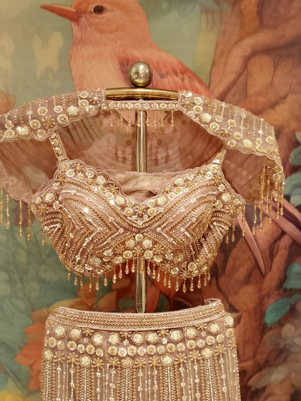 Champagne Gold Fish-Cut Net Lehenga Set with Pearl Fringe Blouse and Cape .