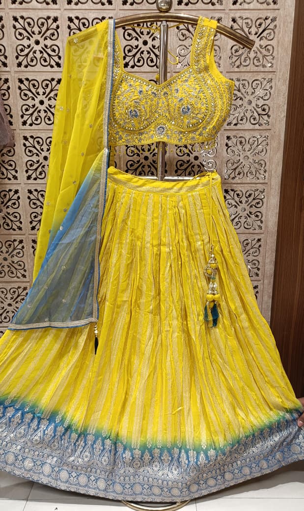 Yellow Simmer Silk Lehenga Choli Set with Turquoise Ombre Border.