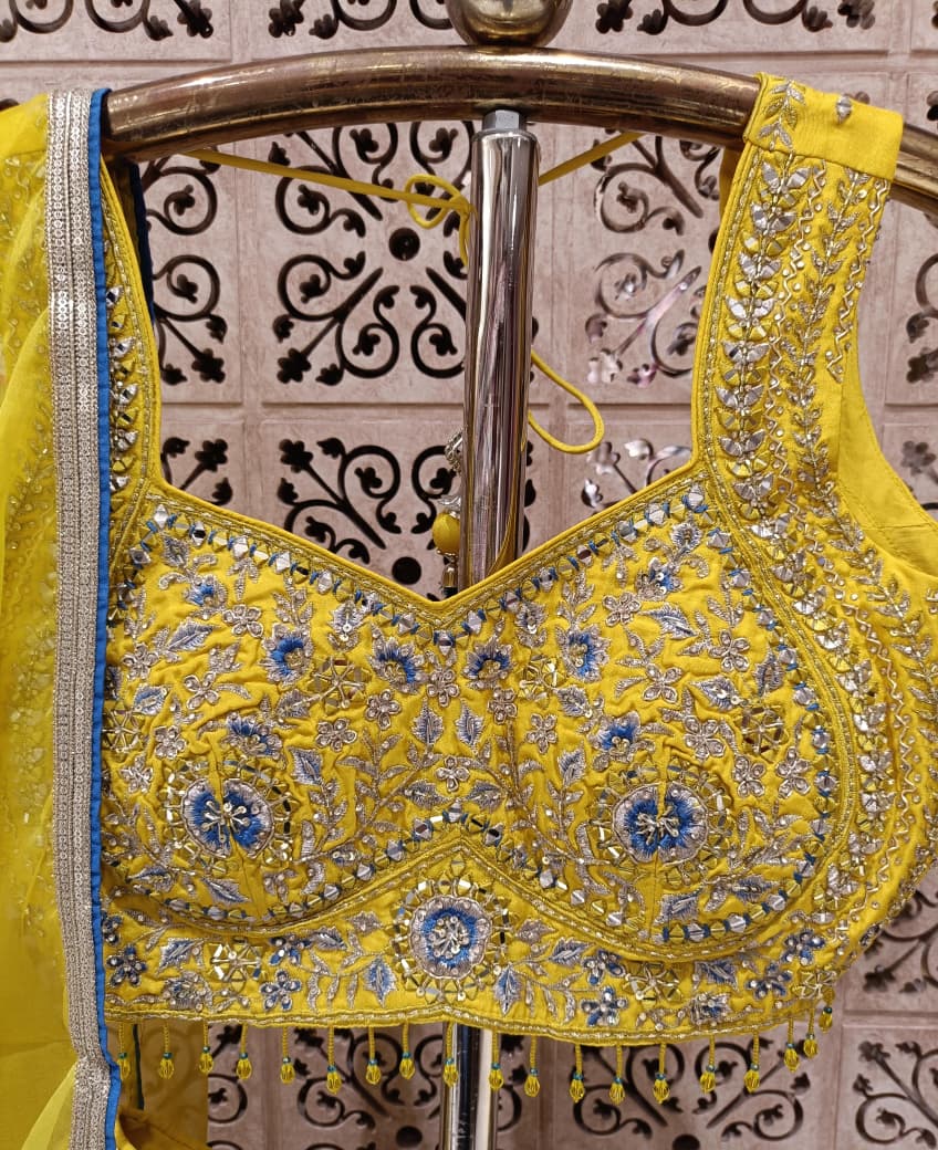 Yellow Simmer Silk Lehenga Choli Set with Turquoise Ombre Border.