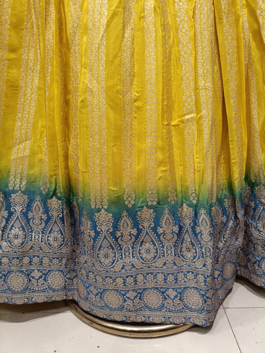 Yellow Simmer Silk Lehenga Choli Set with Turquoise Ombre Border.