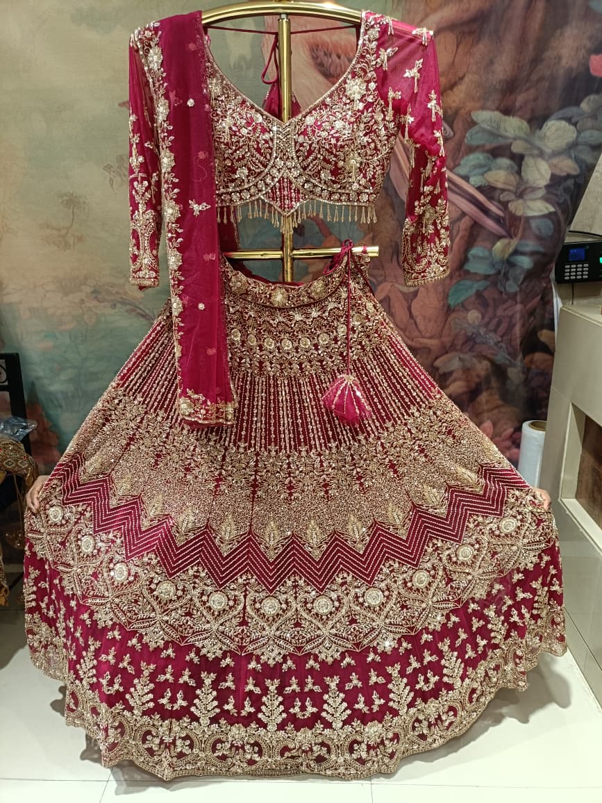 Magenta Pink Hand-Embroidered Bridal Lehenga Choli Set.