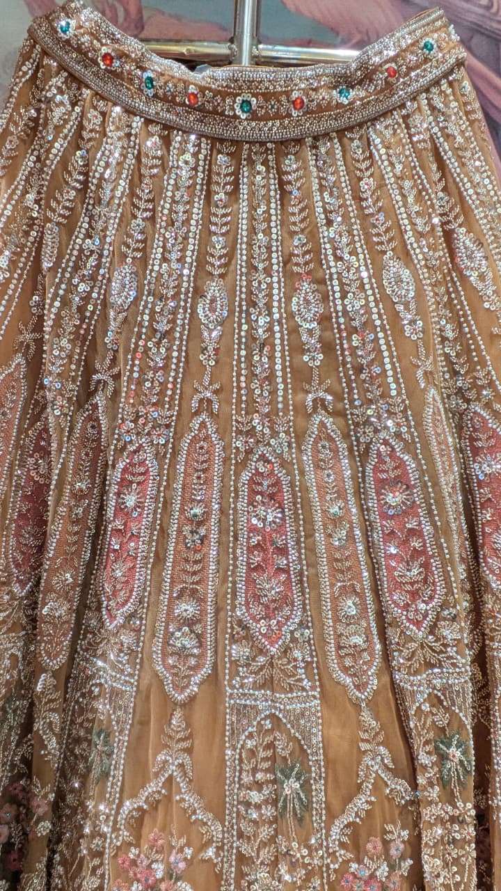 Opulent Beige-Gold Peacock Motif Bridal Lehenga Choli Set.