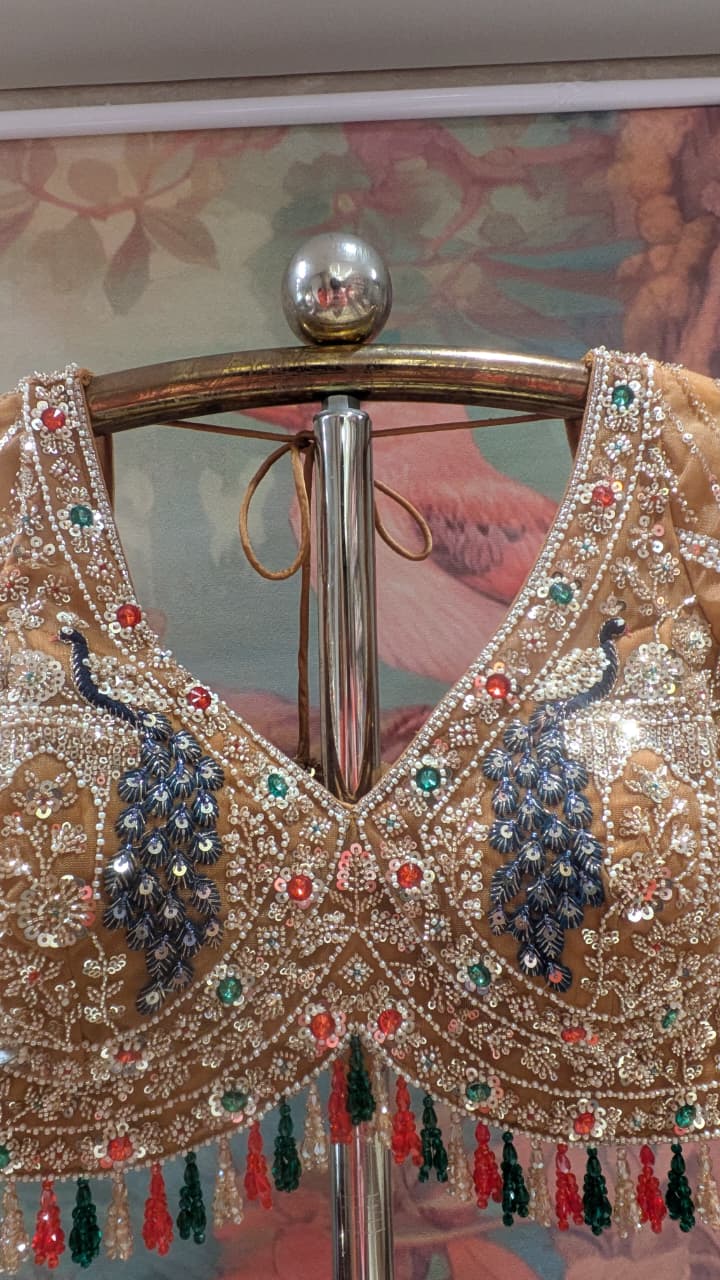 Opulent Beige-Gold Peacock Motif Bridal Lehenga Choli Set.