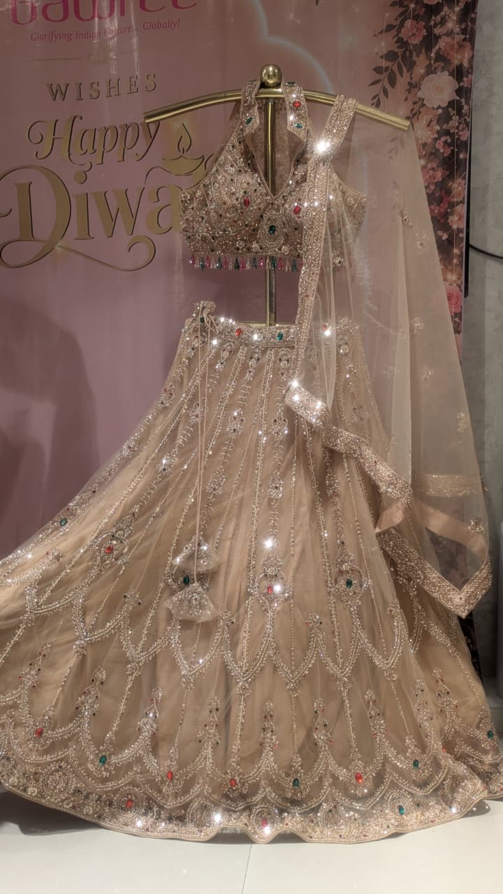 Glamorous Champagne Gold Halter-Neck Lehenga Set.