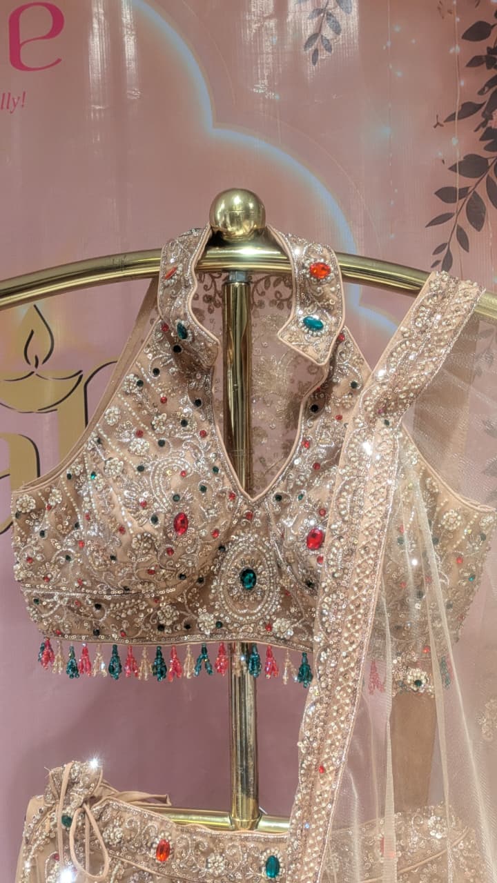 Glamorous Champagne Gold Halter-Neck Lehenga Set.