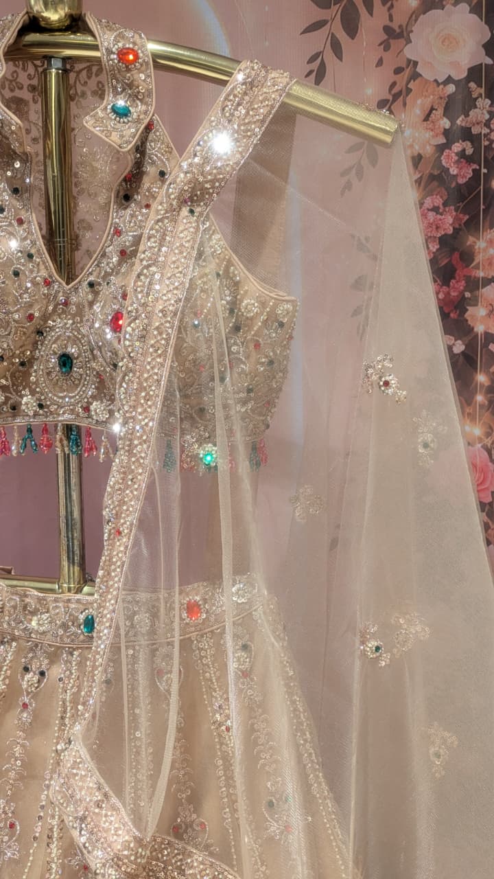Glamorous Champagne Gold Halter-Neck Lehenga Set.