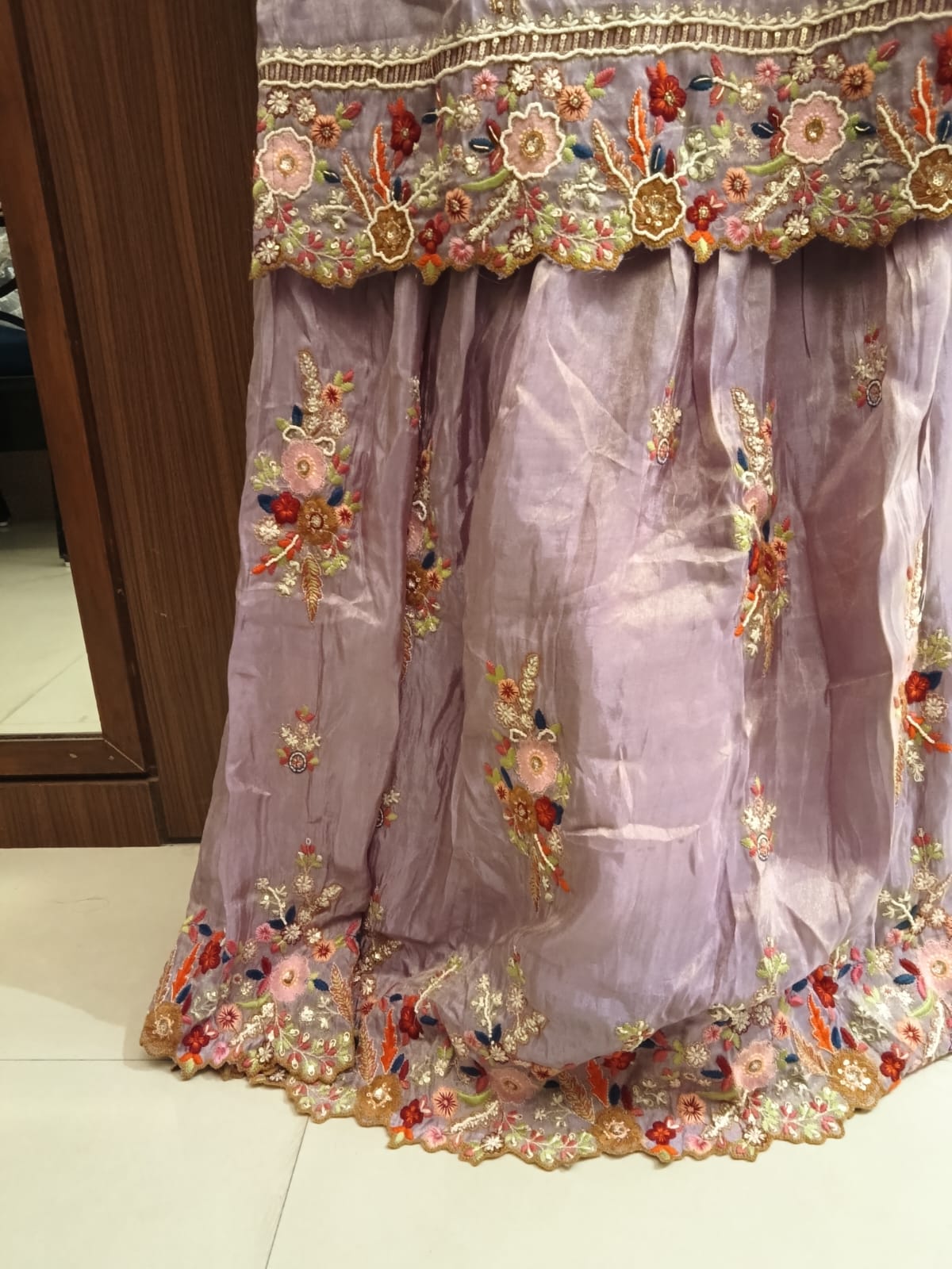 This is a premium, elegant 3-piece traditional ethnic ensemble designed to bring out a sophisticated and festive look.