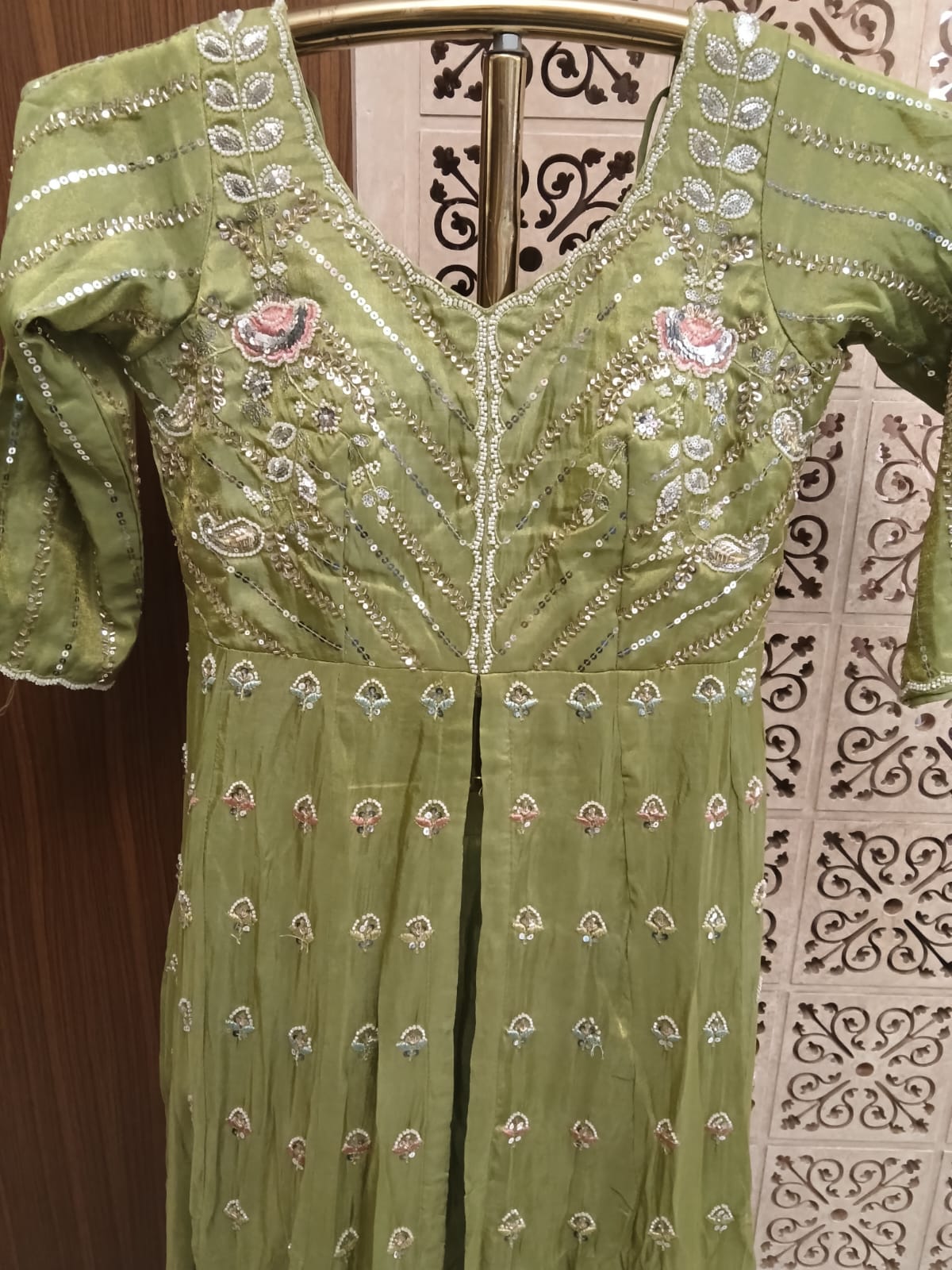 This stunning olive green Anarkali suit set blends traditional elegance with contemporary grace