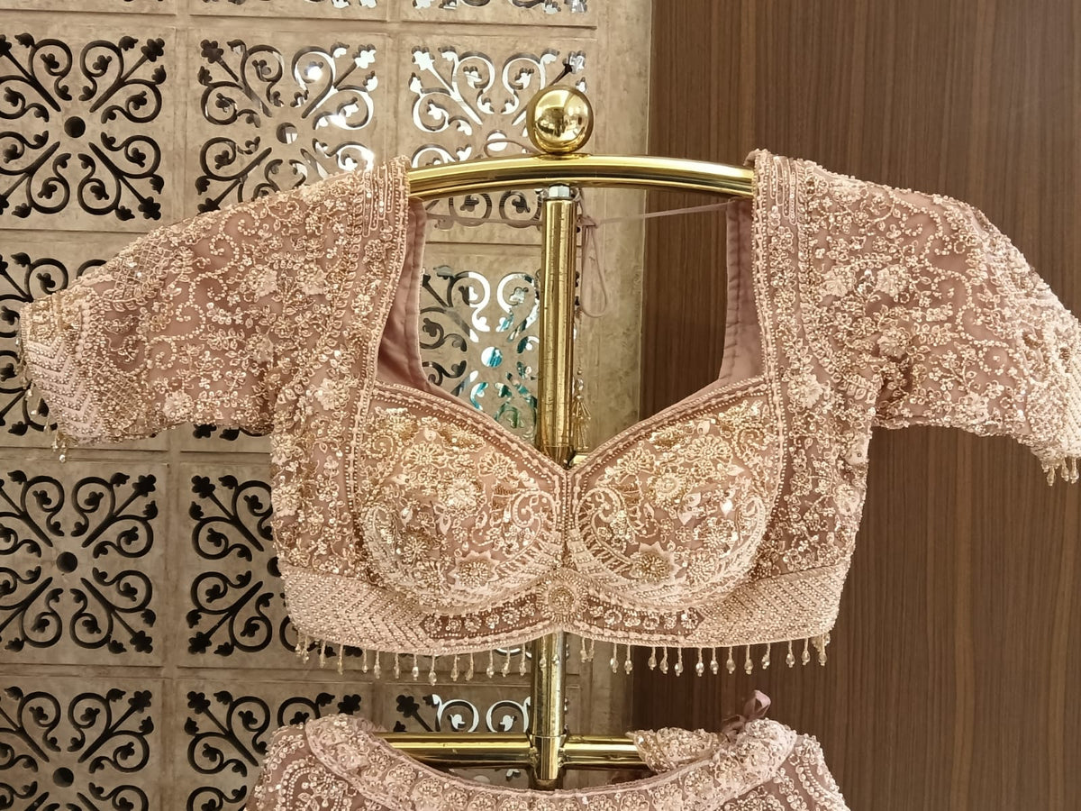exquisite pastel peach lehenga choli