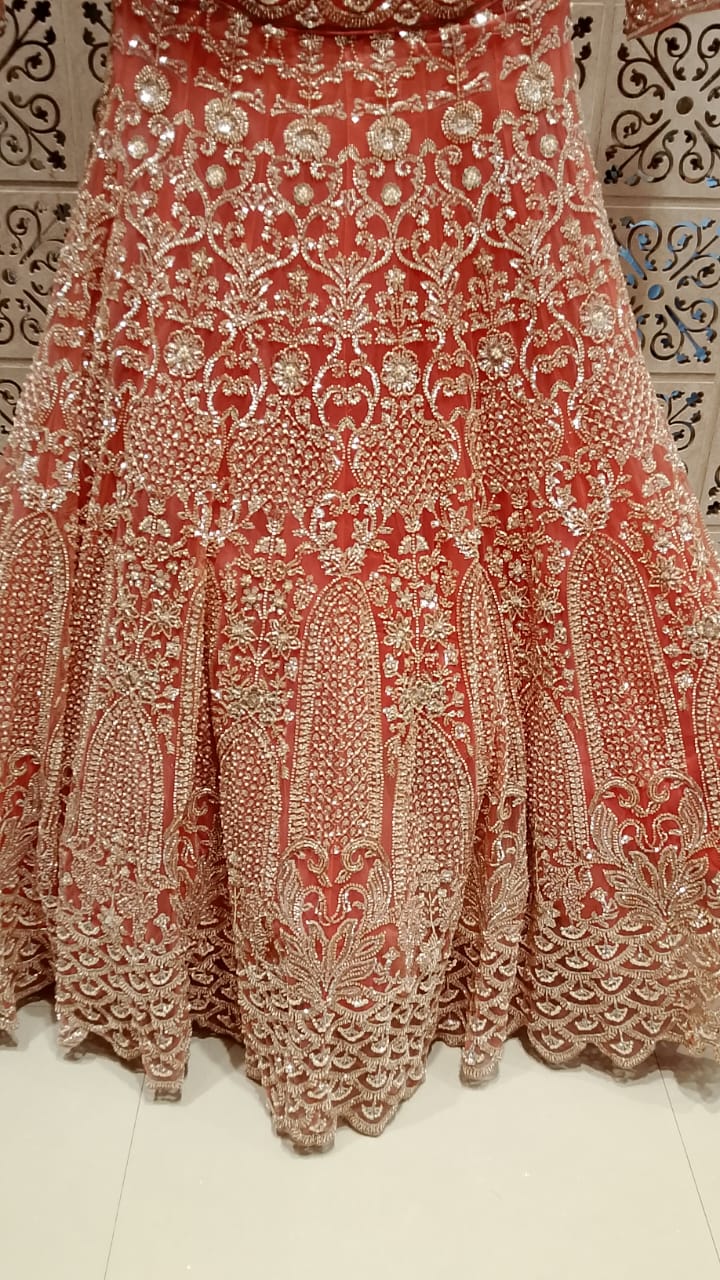 Ethereal Peach-Coral Heavily Embellished Bridal Lehenga