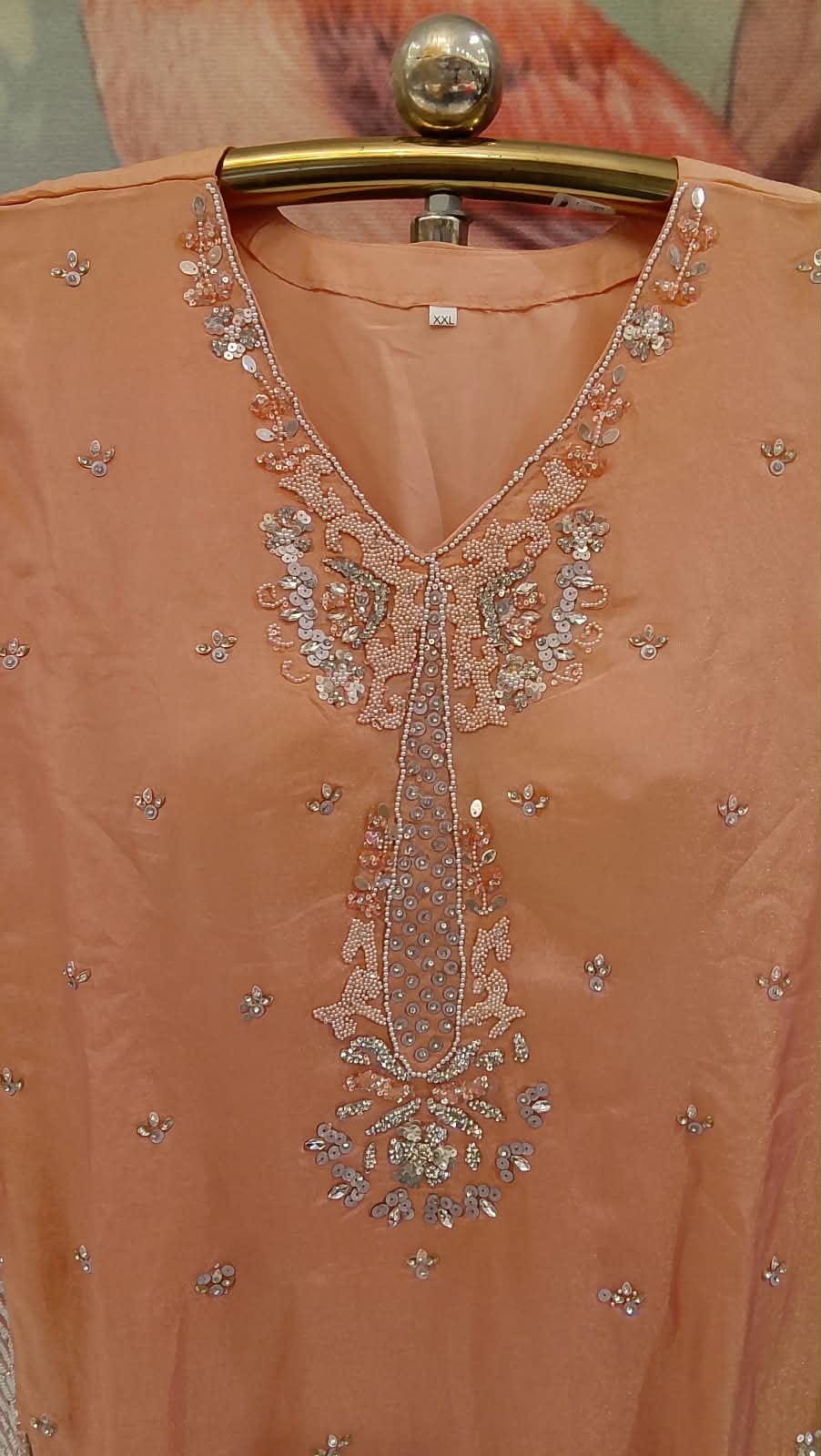 Elevate your festive wardrobe with our stunning Peach Orange and Champagne Salwar Suit Set. Ideal for festivals, family gatherings, and pre-wedding events.