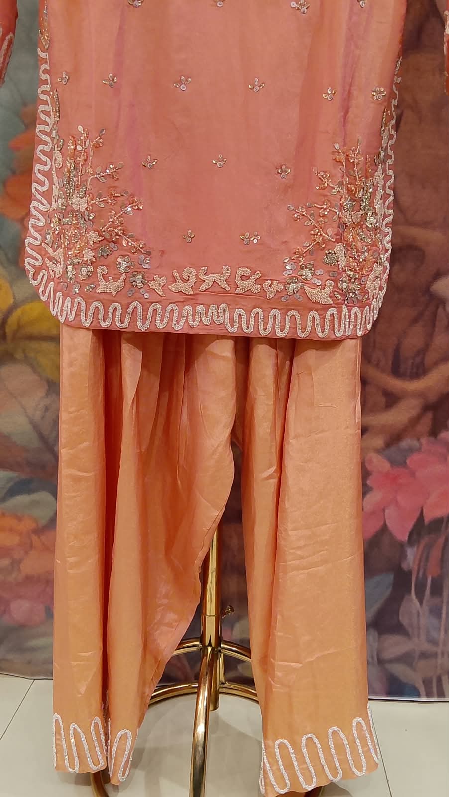 Elevate your festive wardrobe with our stunning Peach Orange and Champagne Salwar Suit Set. Ideal for festivals, family gatherings, and pre-wedding events.