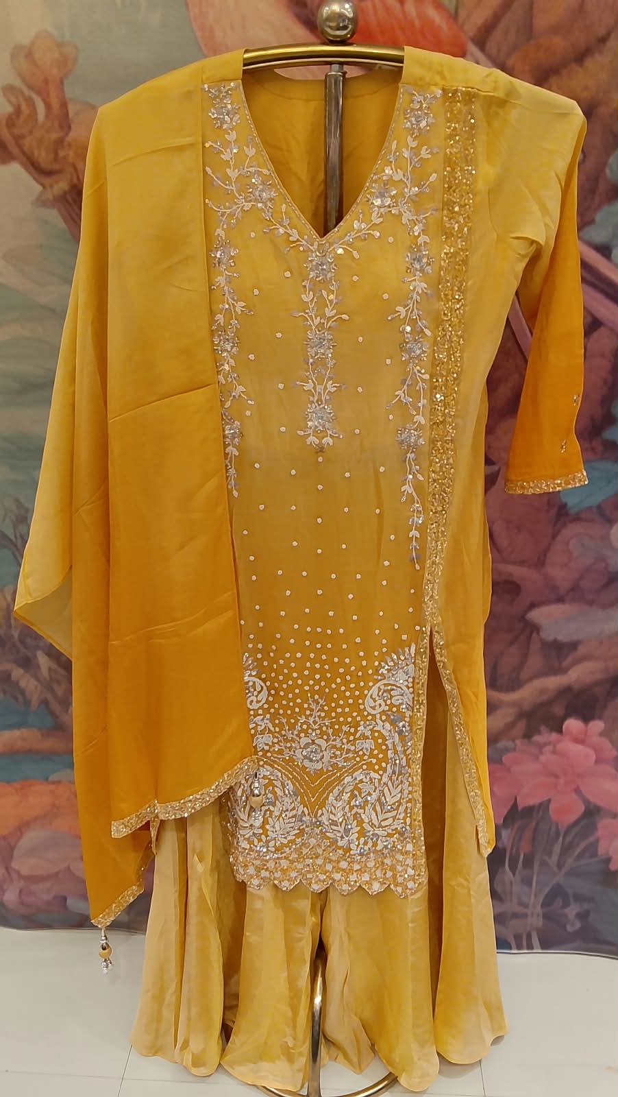 Radiate timeless luxury in our vibrant Sun Flower Yellow Heavily Hand Work Gharara Set.