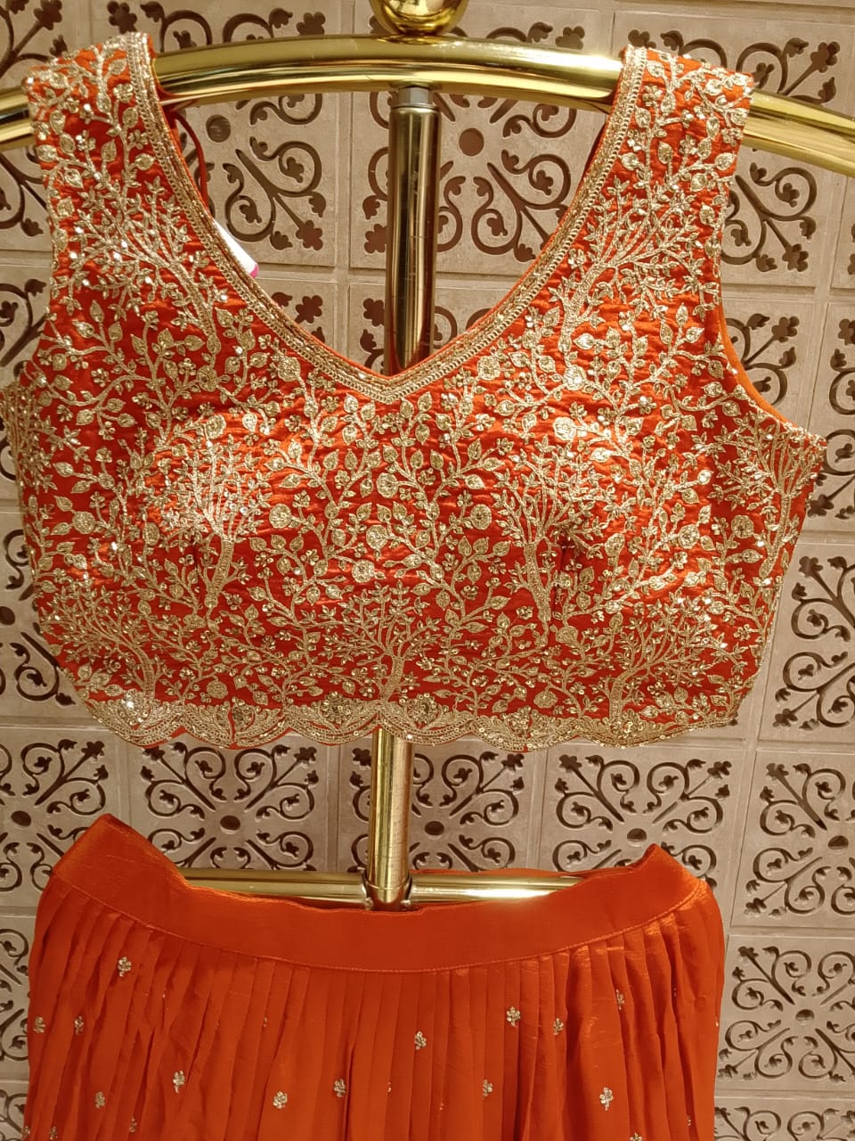 Opulent Rust Orange Embroidered Georgette Lehenga Choli Set.