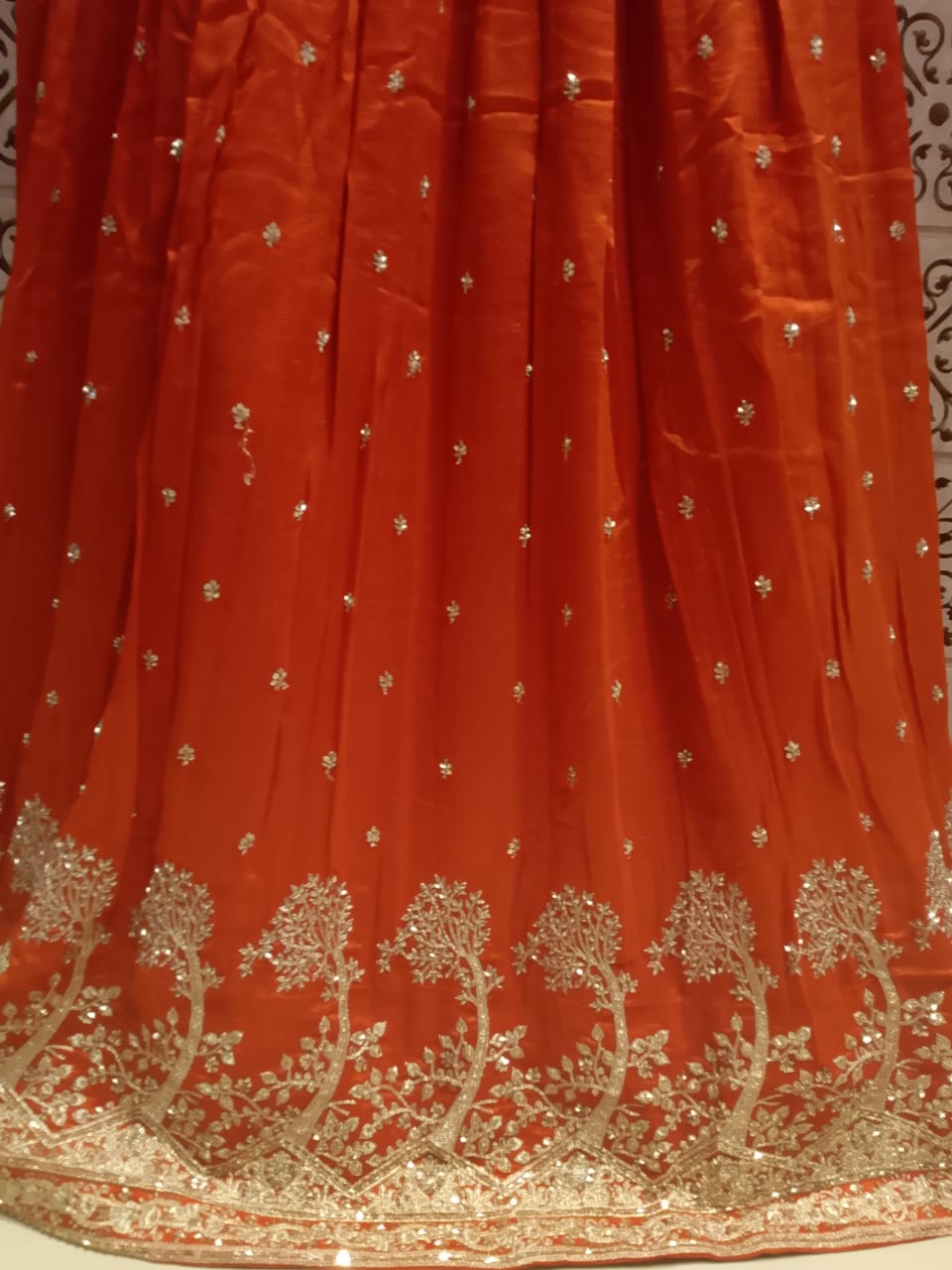 Opulent Rust Orange Embroidered Georgette Lehenga Choli Set.