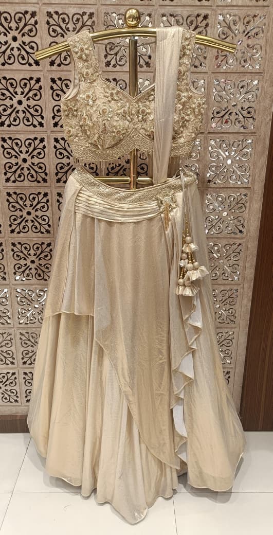 Champagne Gold Draped Satin Silk Hand Work Lehenga Choli Set.