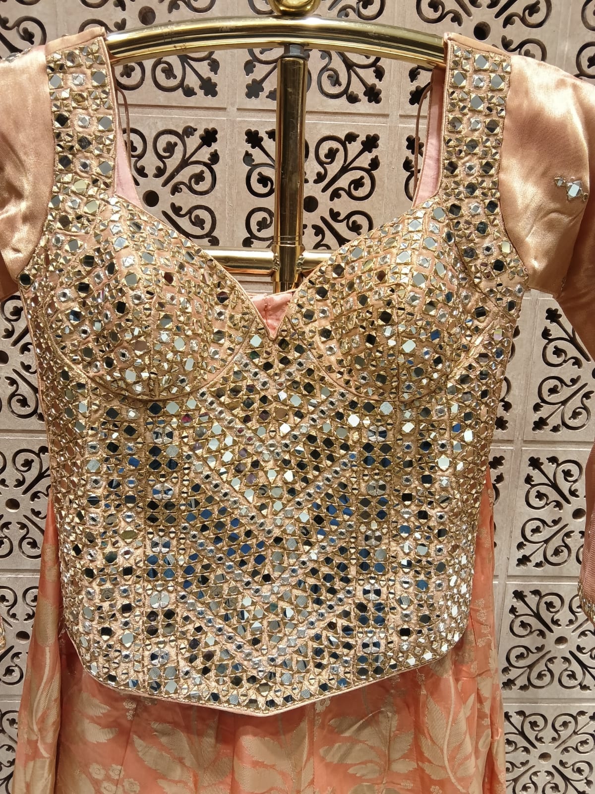 Simmer Peach Banarasi Lehenga with Heavy Mirror Corset Blouse.