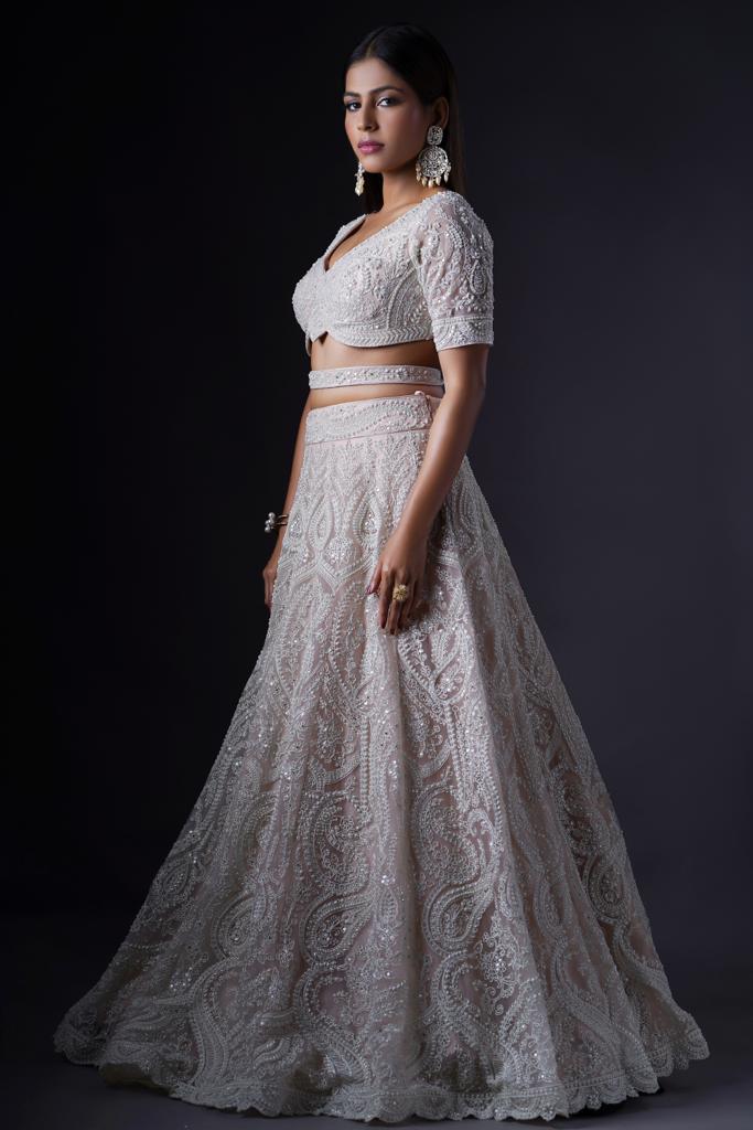 Buy Powder White Lehenga Choli With Elaborate Balloon Sleeves And Multi  Colored Hand Embroidered Buttis Online - Kalki Fashion